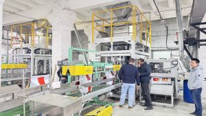 Two units 25kg pet food automatic weighing bagging conveying and palletizing line start running in our client factory